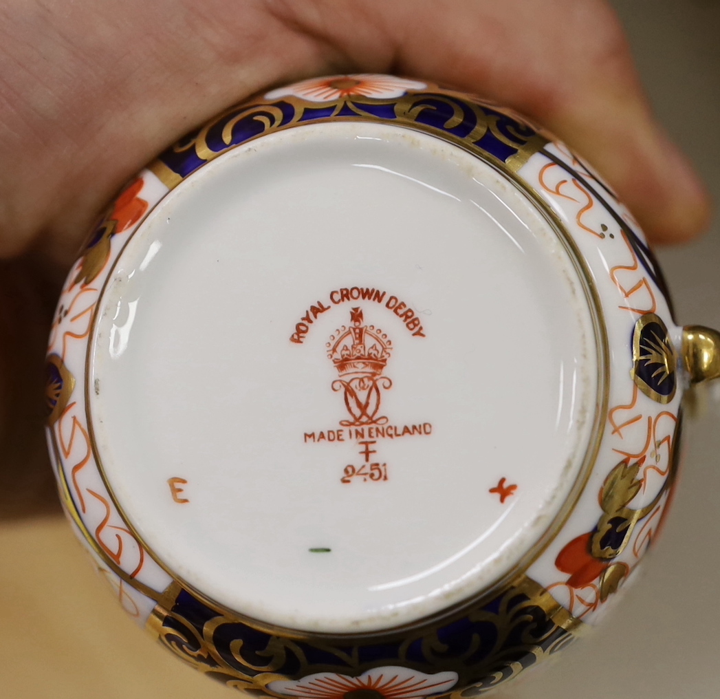 A Royal Crown Derby spherical vase with pie crust rim painted with pattern 1128, a two handled dish in the same pattern, five cups and three saucers in pattern 2451